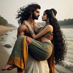 a man and woman standing next to each other on a beach near the ocean with long hair