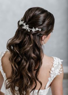 a woman wearing a bridal hair comb