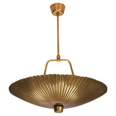 a large brass plated light fixture hanging from the ceiling