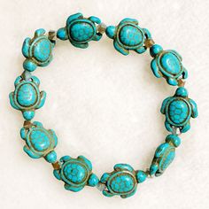 This stretch bracelet is hand crafted with turquoise turtle beads.  Each bead is made with a realistic turtle look (shell details can be seen in photos).  Size of Bead: Approximately 16mm  Stretches with ease.  Great gift for friends and loved ones. Casual Handmade Turquoise Stretch Bracelet, Casual Hand-strung Turquoise Stretch Bracelet, Casual Turquoise Hand-strung Stretch Bracelet, Casual Turquoise Stretch Bracelet, Casual Turquoise Stretch Bracelet With 8mm Beads, Spiritual Turquoise Stretch Bracelet For Beach, Handmade Adjustable Turquoise Stretch Bracelet, Adjustable Turquoise Stretch Bracelet As Gift, Turquoise Bracelets