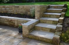 stone steps leading up to a garden area