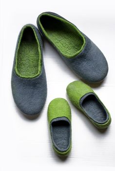 three pairs of slippers sitting on top of a white table