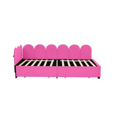 a pink bed with black and white stripes on it's headboard, sitting in front of a white background