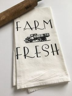 two tea towels with the words farm fresh on them