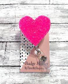 "PINK CHUNKY GLITTER HEART Feltie Badge Reel. These Retractable ID badge Holders will dress up your uniform or outfit with a burst of color and excitement! These retractable badge reels are perfect for nurses, doctors, hospital workers, physician assistants, office staff, teachers, students, secretaries, dentists, dental assistants, child care workers, anyone that works in a secured building, wears a swipe card, or any person that is required to wear a Name Tag identification. NEW Badge Reel Cho Cheap Everyday Pink Badge Holders, Neon Pink Heart, Ultrasound Tech, Hospital Workers, Nurses Week Gifts, Swipe Card, Nurse Week, Medical Badge, Hot Pink Roses