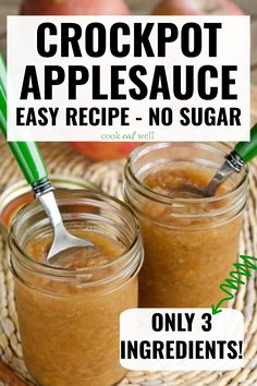 two jars filled with crockpot applesauce sitting on top of a table