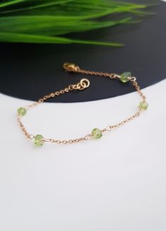 Gold Peridot Bracelet, Peridot Bracelet for Women, Peridot Birthstone Jewelry, August Birthstone Bracelet, Dainty Gold Bracelet Gift For her This is a delicate natural raw Peridot bracelet  All of our jewelry is handmade and every stone is handpicked for the best quality. the color and size of each stone are natural, unique, and individual. Our Elegant Green peridot bracelet is great for a bridesmaid gift, Birthday gift, Bridal Gift, Christmas gift... Each bracelet will be packed in beautiful gi Green Dainty Bracelets With Natural Stones, Dainty Green Bracelets With Natural Stones, Dainty Green Bracelet With Natural Stones, Green Round Birthstone Bracelet, Adjustable Peridot Bracelets For Gifts, Adjustable Peridot Bracelet, Green Chain Bracelet For May Birthstone, Green Peridot Round Bracelets, Adjustable Dainty Green Chain Bracelet