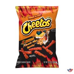 a bag of cheetos sitting on top of a white table next to fire