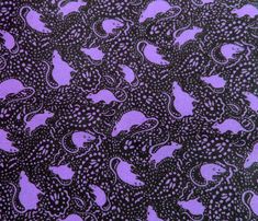 a purple and black pattern with cats on it