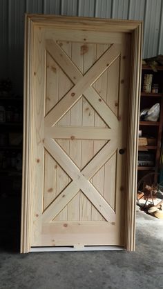 a wooden door in the middle of a room