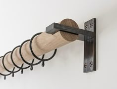 a wall mounted wine bottle rack with six corks