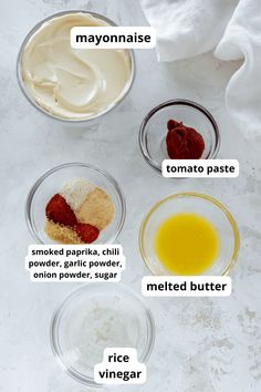 the ingredients for making strawberry shortcakes are shown in small bowls on a white surface