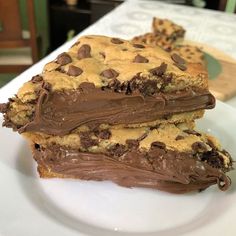 two pieces of chocolate chip cookie bars on a plate