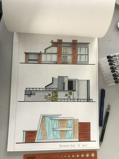 a drawing of a house on top of a paper