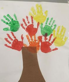 a child's handprint tree made out of paper