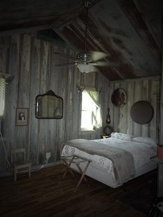 a bedroom with wood paneling and white bedding