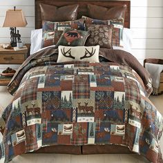 a bed covered in a brown and blue plaid comforter