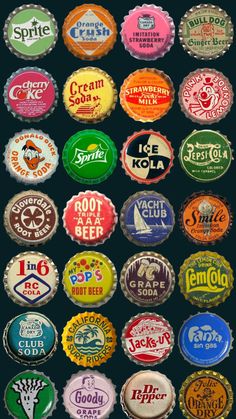 a bunch of different types of beer bottle caps in various colors and sizes on a black background