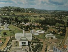 an aerial view of a city with buildings and trees