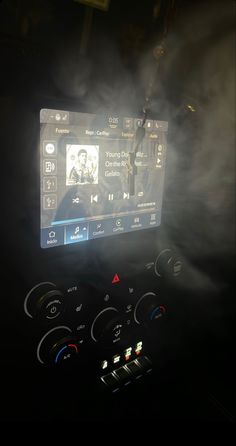 the dashboard of a car is shown with steam coming out of it's screen