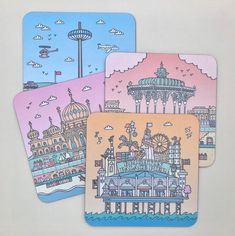 three coasters with an image of a building and ferris wheel in the middle one