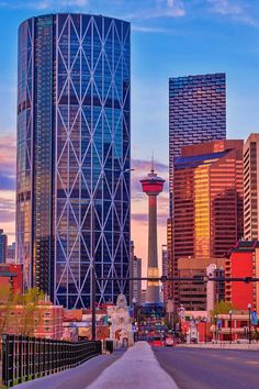 a city skyline with tall buildings in the background