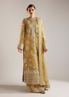 Product Description: This silhouette brings a modern charm to your wardrobes with its pastel lime yellow color, composed with cross stich floral motifs all over and with distinctive daman borders. Further it features velvet palazzo with color block embellished border and with net dupatta composed with pearl spray and with heavy embellished four side borders. Colour: Lime Yellow Fabric Details: Shirt: Organza ( length: 54", Neckline B Festive Gold Churidar With Chikankari Embroidery, Gold Salwar Kameez With Chikankari For Navratri, Navratri Gold Salwar Kameez With Chikankari Embroidery, Gold Unstitched Suit With Dabka Work For Transitional Season, Floor-length Organza Churidar For Eid, Eid Shantoon Churidar With Intricate Embroidery, Festive Shantoon Salwar Kameez With Intricate Embroidery, Gold Floor-length Kurta For Eid, Festive Chikankari Embroidery Churidar In Shantoon