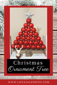 a christmas ornament tree made out of red balls on a wooden table with text overlay that reads, christmas ornament tree