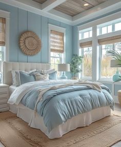 a bedroom with blue walls and white furniture