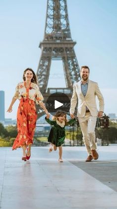 the family is walking in front of the eiffel tower