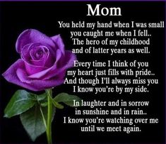 a purple rose sitting on top of a table next to a poem that says mom