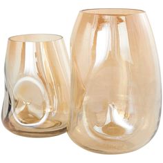 two glass vases sitting next to each other