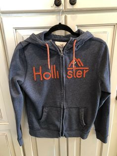 HOLLISTER Mens XS Blue with orange embroidery Sweatshirt Jacket FULL ZIP Hoodie California EUC Casual Blue Outerwear With Logo Print, Casual Hooded Outerwear With Branding, Orange Embroidery, Embroidery Sweatshirt, Blue Sweatshirt, Full Zip Hoodie, Zip Hoodie, Hollister, Athletic Jacket