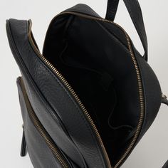 Blackbird Backpack by Urban Originals is a versatile addition to any wardrobe. This amazing roomy bag effortlessly fits all your everyday essentials. It features a spacious front pocket and a convenient sleeve compartment inside. Made from pebbled vegan leather and adorned with stud details on the straps, the Blackbird Backpack combines style and practicality. Elevate your daily carry with this must-have bag! Commuting Softback Bag With Zipper Pocket, Commuting Crossbody Backpack With Zipper, Commuting Crossbody Backpack With Zipper Closure, Commuting Backpack With Zipper Closure, Commuting Backpack Shoulder Bag, Commuting Shoulder Bag Backpack, Everyday Leather Crossbody Backpack With Zipper, Leather Softback Backpack With Zipper Pocket For On-the-go, Everyday Leather Backpack With Zipper Pocket