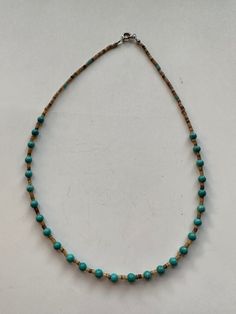 This beautiful Navajo Turquoise and Heishi Beaded Necklace adds a touch of western charm to any outfit. The stunning combination of turquoise and heishi beads creates a gorgeous, chic look that is sure to make a statement. Elevate your style with this unique and eye-catching necklace! Turquoise & Heishi Beaded Necklace 16" Long Navajo Beads are natural and may vary