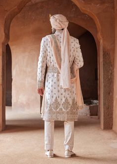 Editor's Note Drape yourself in sophistication with our blush pink taffeta silk sherwani, featuring delicate embroidery in light gold dabka, elegantly accented by contrast resham French knots. ... Silk Kurta, French Knots, Mens Luxury Fashion, Pattern Embroidery, Groom Attire, Silk Embroidery, Sherwani, Full Sleeves, Embroidery Work