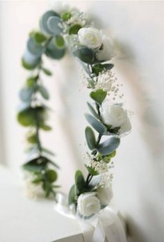 Elegant and simple floral wreath.  Made with eucalyptus leaves and white tea cup flowers. Perfect for maternity shoots, wedding attire, or that beautiful boho look  These can be made in sizes ranging from babies to adult.  All floral crowns need supervision for infants, they come with ribbon and small flowers that can come off when pulled. Winter Floral Crown, Eucalyptus Flower Crown, Winter Crown, Flower Eucalyptus, Flower Girl Wreaths, Flower Head Wreaths, White Flower Crown, Headpiece Flower, Bridal Floral Headpiece