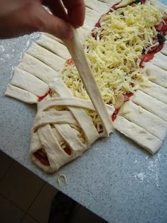 someone cutting up some food on top of a counter