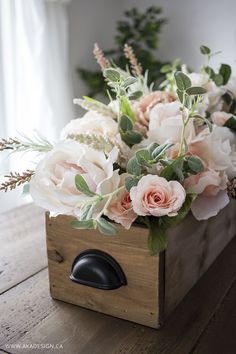 a wooden box with flowers in it and the words diy faux floral arrangement feminine rustic crate