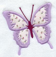 a purple butterfly with white dots on it's wings