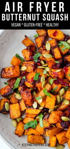 a white bowl filled with roasted butternut squash