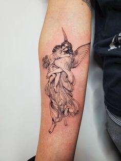 a tattoo on the arm of a woman with an angel and flowers in her hair