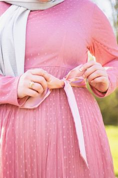 muslim woman wearing silver shimmer jersey hijab and a pink long sleeve maxi dress with polka dots and satin waist belt Fitted Long Sleeve Polka Dot Maxi Dress, Fitted Long Sleeve Swiss Dot Dresses, Feminine Long Sleeve Swiss Dot Dress, Polka Dot Maxi Dress, Polka Dot Maxi Dresses, Pink Maxi Dress, Polka Dot Dress, Hidden Zipper, Charcoal Grey