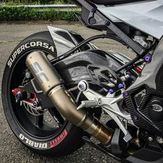 the front end of a motorcycle parked in a parking lot