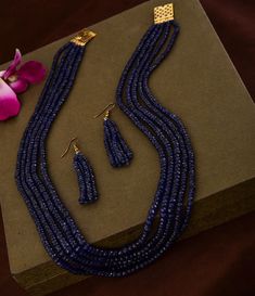 Natural Genuine Dark Blue Sapphire Beaded Necklace With Earrings NW : 600 carats GW : 625 carats No. Of Layers : 5 Model Image Necklace Length : 16-18 inches 1 gm 18k Gold Clasp Set in Sterling Silver 925 Non-Tarnishable Skin Tested 18k Gold Plated Clasp To Avoid Any Tarnishing Provided with GRS Lab Certification Real Time Image. No Tampering **Please note all the gemstones we use at RiyaJewels are completely natural , unheated and non-treated* Riya Jewels Has Set New Standards In Contemporary S Sapphire Beaded Rondelle Jewelry, Elegant Sapphire Beaded Necklaces With Gemstones, Elegant Sapphire Round Bead Jewelry, Elegant Sapphire Beaded Necklace With Gemstone, Elegant Sapphire Jewelry With Round Beads, Elegant Blue Faceted Beads, Elegant Sapphire Beaded Jewelry, Elegant Blue Polished Beads, Sapphire Jewelry With Faceted Round Beads