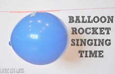 a blue balloon hanging from a string with the words balloon rocket singing time