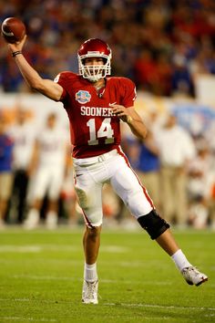 a football player is about to throw the ball