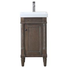 a bathroom vanity with a white sink and wooden cabinet