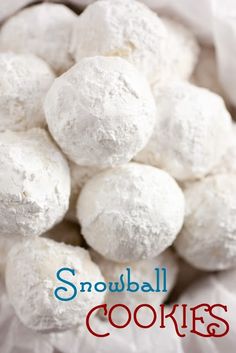 a pile of snowball cookies sitting on top of each other