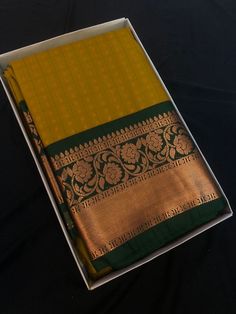 Indulge in the timeless allure of our Semi Kanjivaram Silk Saree ! Crafted with utmost care and precision, this saree exudes sheer elegance and sophistication. The lustrous semi silk fabric drapes beautifully around your body, while the intricate gold zari work adds a touch of regality. Whether you're attending a wedding or a formal dinner, this saree is sure to make heads turn.  .An unstitched blouse fabric is included. *NOTE: There might be slight differences in the colour and texture of the product due to factors such as lighting conditions, device settings, and colour correction. Classic Traditional Wear With Traditional Drape For Festive Occasions, Classic Festive Traditional Wear With Traditional Drape, Classic Diwali Traditional Wear With Zari Work, Classic Traditional Wear With Pallu For Festive Season, Classic Festive Zari Work Saree, Classic Saree With Zari Weaving, Classic Saree With Pallu In Traditional Drape, Classic Festive Saree With Zari Work, Classic Traditional Wear With Pallu Drape